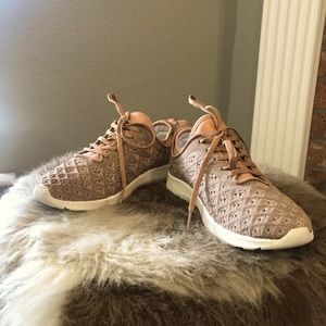 “Not Rated” gold shimmer tennis shoes.